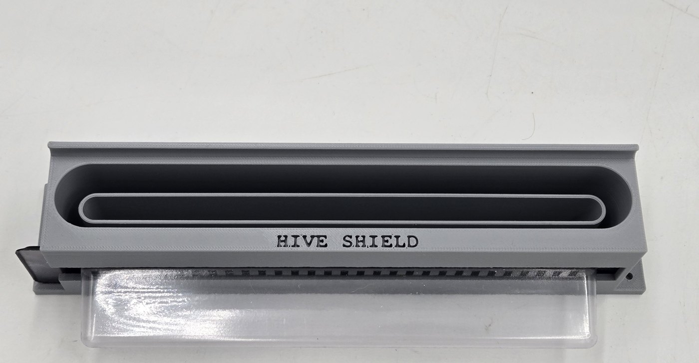 Front product view of Hive Shield showing the entrance opening and removable tray