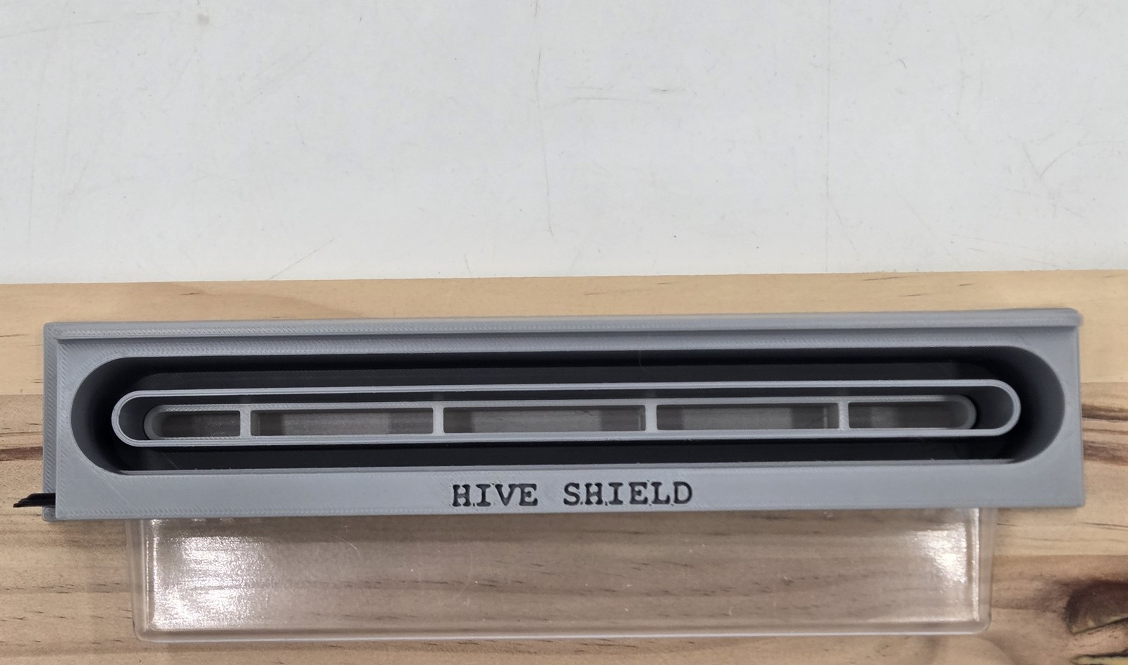 Hive Shield mounted on a hive entrance board with the beetle collection tray attached
