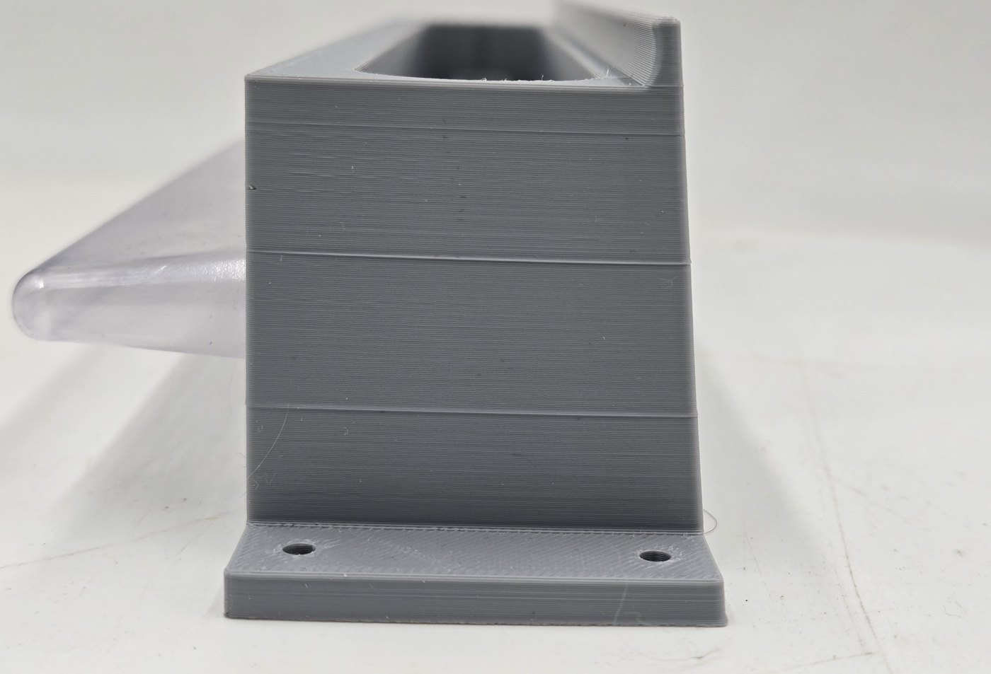 Side profile of Hive Shield showing the trap depth and clear collection tray